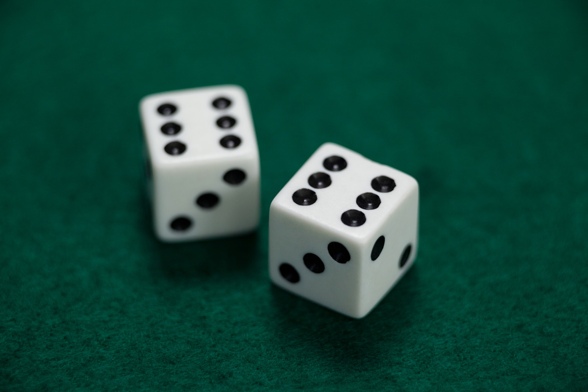 Pair of dice on poker table